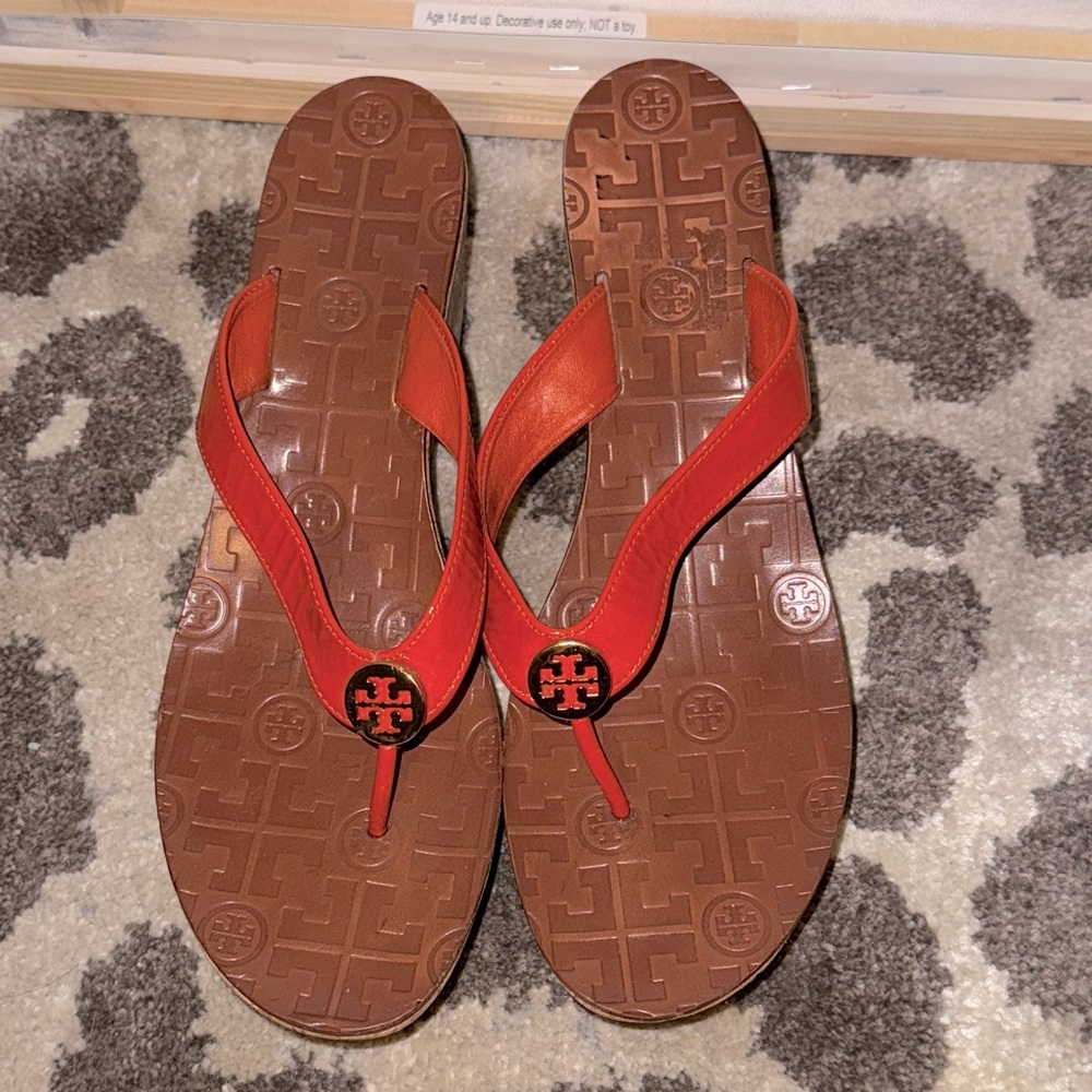Tory Burch cork wedge flip flop sandals in orange and tan